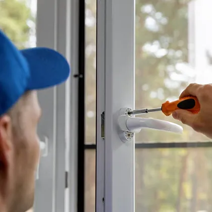 Close-up of a person expertly sealing a window, demonstrating the benefits of professional window replacement services for improved energy efficiency and enhanced property value.